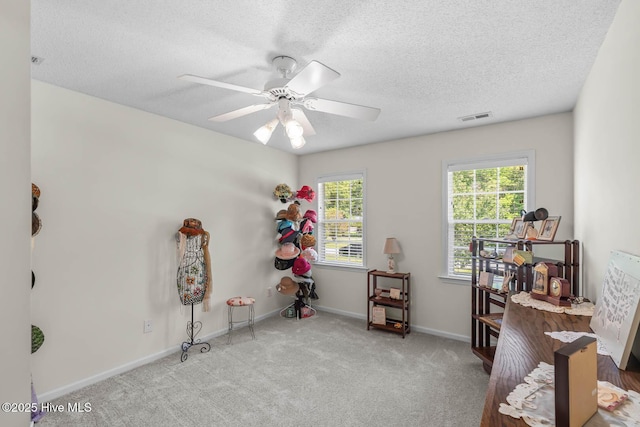 154 Dockside Dr, Jacksonville, NC 28546 - miscellaneous room featuring a ceiling fan, a textured ceiling, carpet, and baseboards