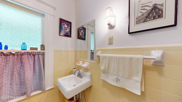 305 E New Hampshire Ave, Southern Pines, NC 28387 - bathroom with tile walls, wainscoting, and a sink