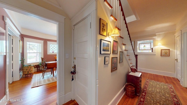 305 E New Hampshire Ave, Southern Pines, NC 28387 - hall featuring light wood-style flooring, stairs, and baseboards