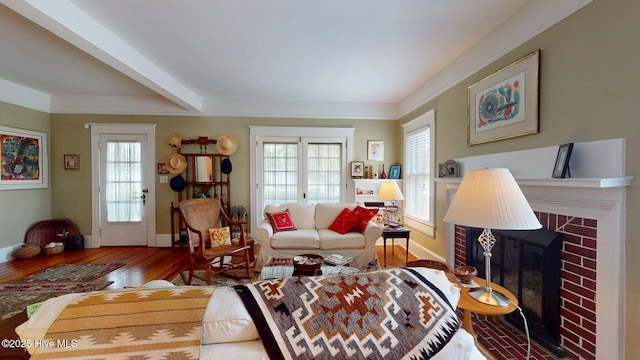 305 E New Hampshire Ave, Southern Pines, NC 28387 - living room featuring wood finished floors, baseboards, and a fireplace