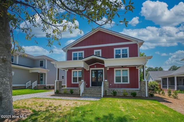468 Yadkin Rd, Southern Pines, NC 28387 - view of front of home featuring a front lawn, french doors, and board and batten siding