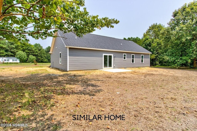 90 NE Dr NW, Calabash, NC 28467 - back of property with a patio area and a shingled roof
