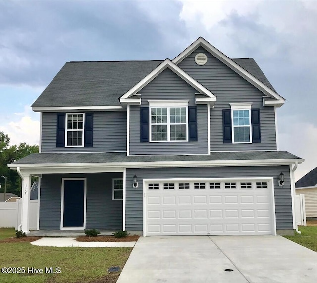 117 Rockland Dr, Greenville, NC 27858 - view of front of property with driveway, an attached garage, and a porch