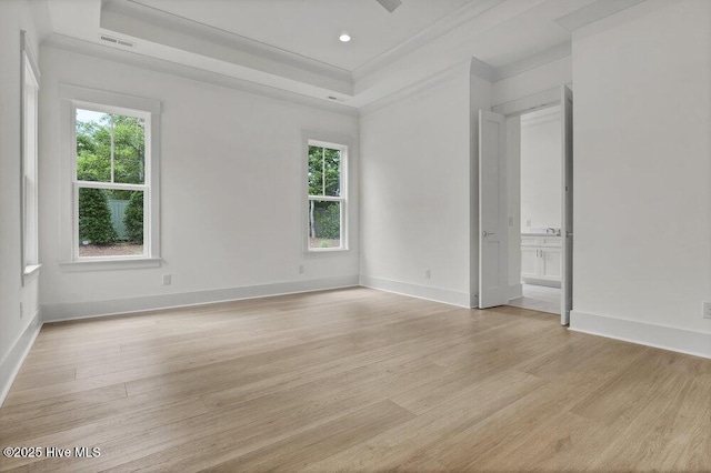 324 Grayhawk Cir, Wilmington, NC 28411 - empty room featuring light wood-type flooring, healthy amount of natural light, a tray ceiling, and recessed lighting