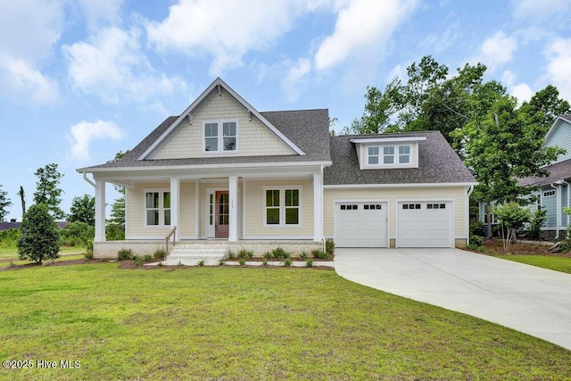 324 Grayhawk Cir, Wilmington, NC 28411 - view of front of home with concrete driveway, an attached garage, a front yard, and covered porch
