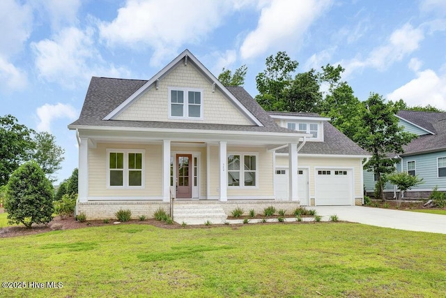 324 Grayhawk Cir, Wilmington, NC 28411 - view of front of property featuring driveway, covered porch, a garage, a front yard, and a shingled roof