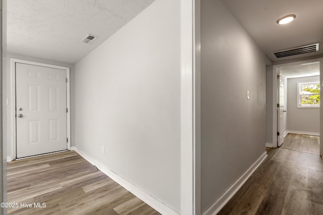 13271 US Highway 17, Hampstead, NC 28443 - corridor with wood finished floors, baseboards, and a textured ceiling