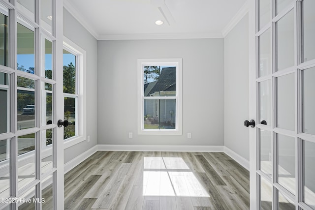 947 Ashburton Rd SE, Bolivia, NC 28422 - empty room with french doors, ornamental molding, wood finished floors, baseboards, and recessed lighting