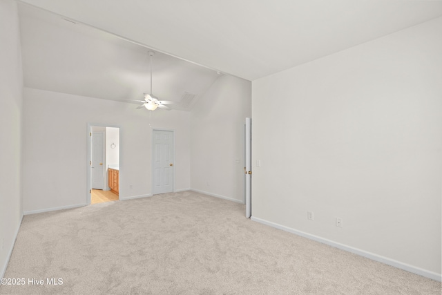 94 Field Planters Cir, Calabash, NC 28467 - spare room featuring lofted ceiling, light carpet, baseboards, and ceiling fan