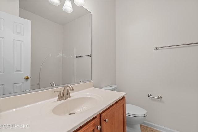 94 Field Planters Cir, Calabash, NC 28467 - bathroom with toilet, vanity, tile patterned flooring, and baseboards