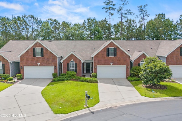 94 Field Planters Cir, Calabash, NC 28467 - view of front of house with brick siding, driveway, and a front yard