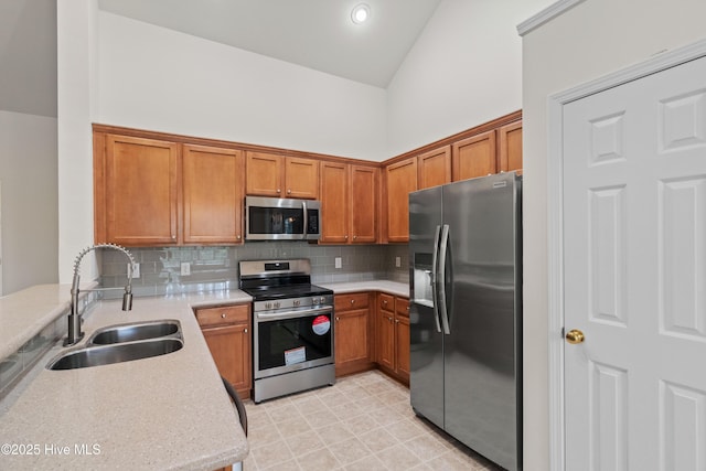 94 Field Planters Cir, Calabash, NC 28467 - kitchen with appliances with stainless steel finishes, a sink, and brown cabinetry