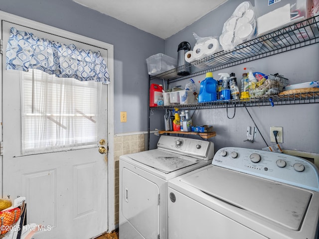 323 Alexander Rouse Rd, Kinston, NC 28504 - washroom featuring washing machine and clothes dryer, tile walls, and wainscoting
