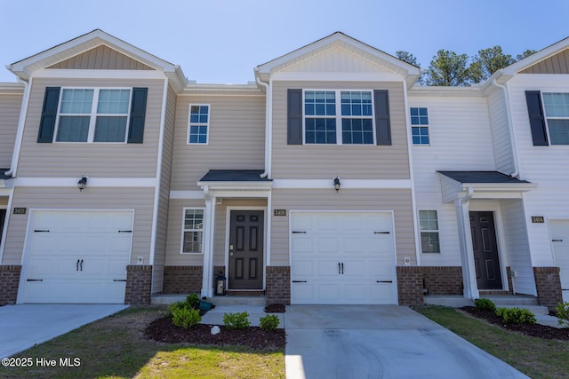 3406 Alibird Ln, Carthage, NC 28327 - multi unit property with concrete driveway, brick siding, and a garage