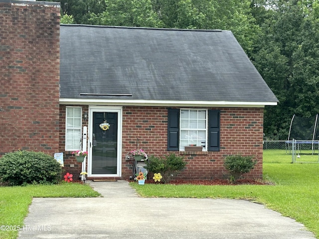 1404 Angels End Unit B, Greenville, NC 27858 - view of front of property with a shingled roof and brick siding