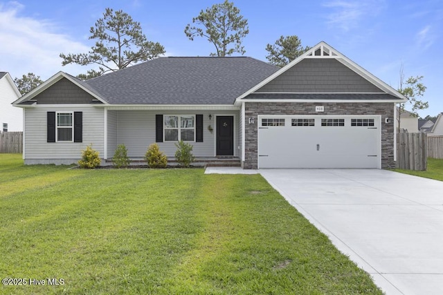 408 Wind Sail Ct, Sneads Ferry, NC 28460 - view of front of house featuring a garage, driveway, and stone siding