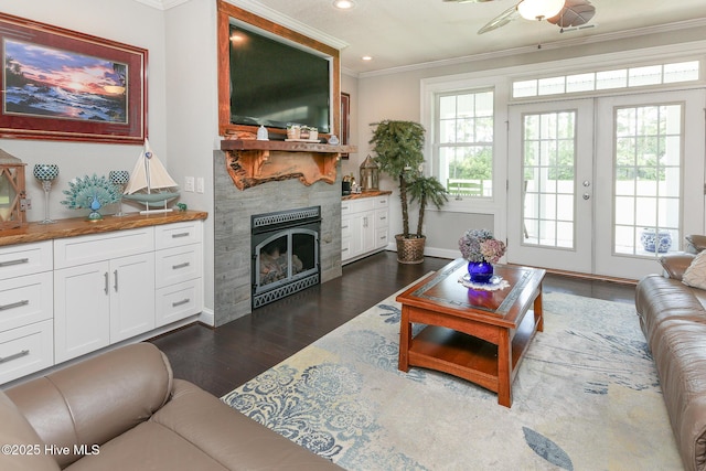 104 Soundside Estates Dr, Grandy, NC 27939 - living area with crown molding, a large fireplace, dark wood finished floors, recessed lighting, and a ceiling fan