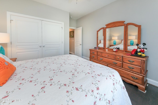 104 Soundside Estates Dr, Grandy, NC 27939 - bedroom featuring baseboards, a closet, and dark wood finished floors