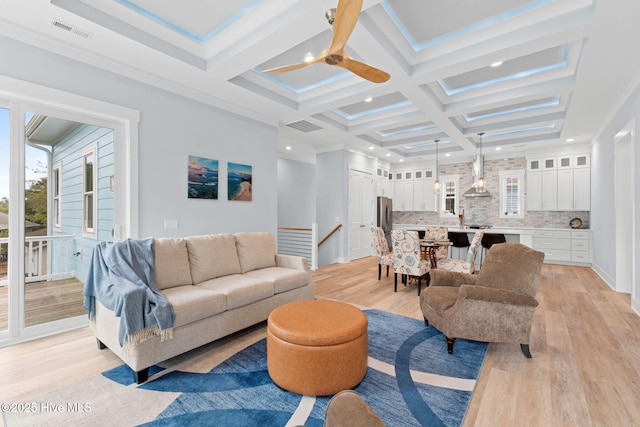 2705 E Oak Island Dr, Oak Island, NC 28465 - living area featuring a ceiling fan, light wood-style floors, coffered ceiling, recessed lighting, and beam ceiling