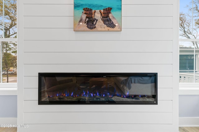 2705 E Oak Island Dr, Oak Island, NC 28465 - detailed view of a glass covered fireplace and wood finished floors
