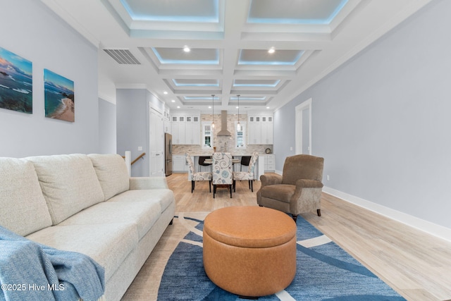 2705 E Oak Island Dr, Oak Island, NC 28465 - living area with light wood-style floors, coffered ceiling, recessed lighting, baseboards, and crown molding