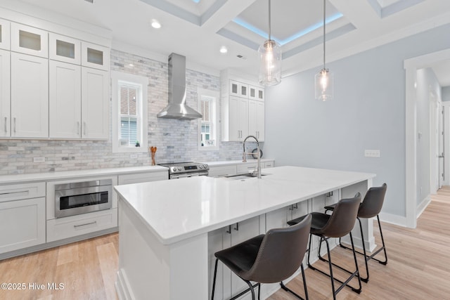 2705 E Oak Island Dr, Oak Island, NC 28465 - kitchen with wall chimney exhaust hood, stainless steel range with electric stovetop, coffered ceiling, a sink, and tasteful backsplash