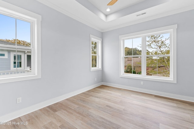 2705 E Oak Island Dr, Oak Island, NC 28465 - unfurnished room featuring light wood-style floors, baseboards, a tray ceiling, recessed lighting, and crown molding