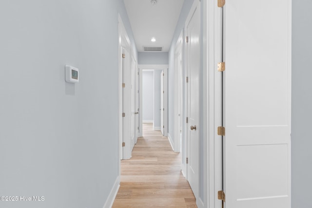 2705 E Oak Island Dr, Oak Island, NC 28465 - hall featuring light wood-type flooring, baseboards, and recessed lighting