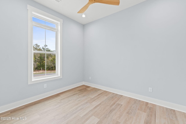 2705 E Oak Island Dr, Oak Island, NC 28465 - empty room with light wood-style floors, baseboards, recessed lighting, and a ceiling fan