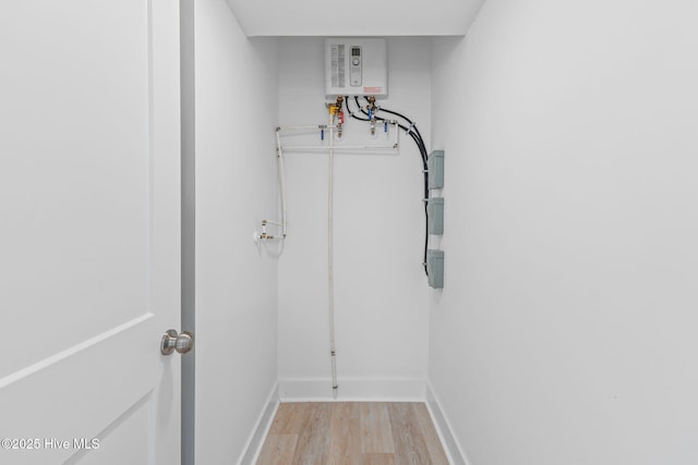 2705 E Oak Island Dr, Oak Island, NC 28465 - interior space featuring light wood-style floors and water heater