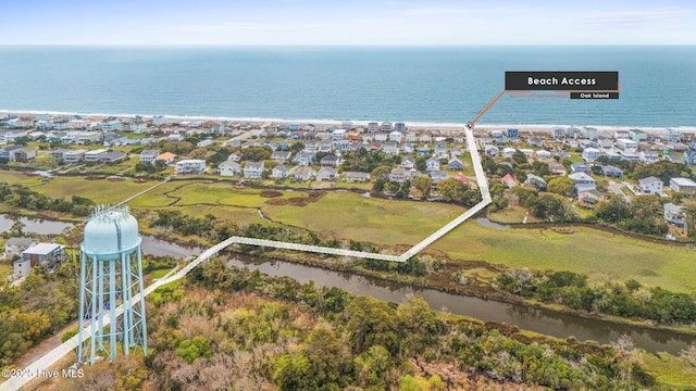 2705 E Oak Island Dr, Oak Island, NC 28465 - aerial view of property and surrounding area featuring nearby suburban area and a nearby body of water