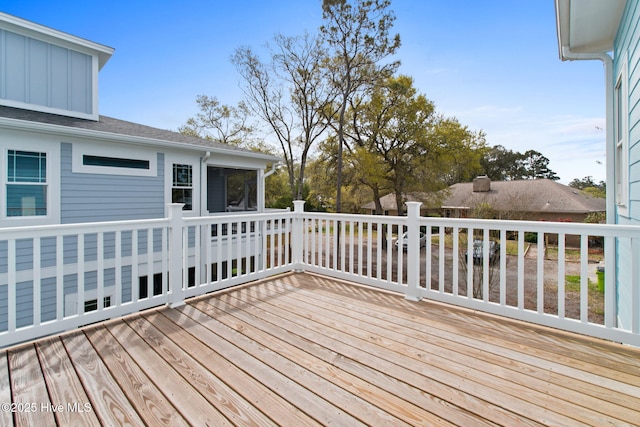 2705 E Oak Island Dr, Oak Island, NC 28465 - deck featuring a sunroom