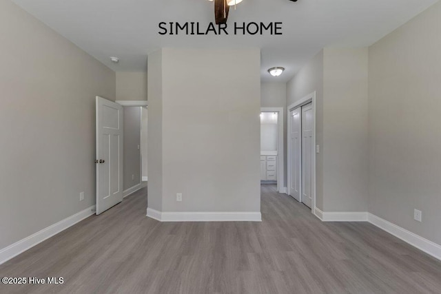 98 NE Dr NW, Calabash, NC 28467 - empty room featuring wood finished floors, baseboards, ceiling fan, and a smoke detector