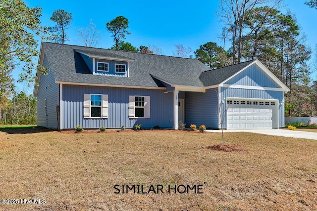 98 NE Dr NW, Calabash, NC 28467 - view of front of house featuring a garage, a front lawn, driveway, and a shingled roof