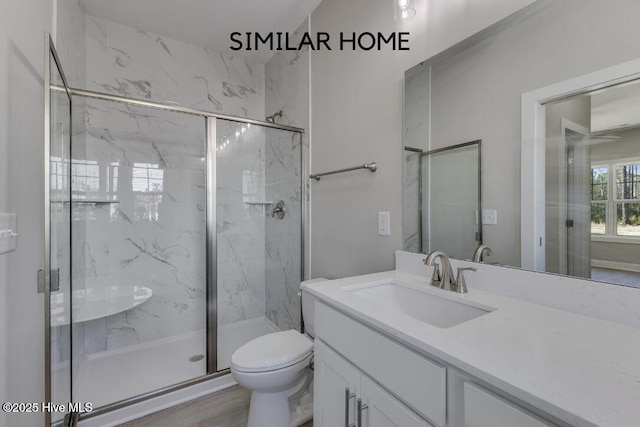 98 NE Dr NW, Calabash, NC 28467 - full bath featuring a marble finish shower, vanity, and toilet