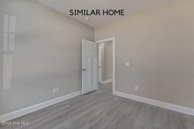 98 NE Dr NW, Calabash, NC 28467 - empty room with wood finished floors and baseboards
