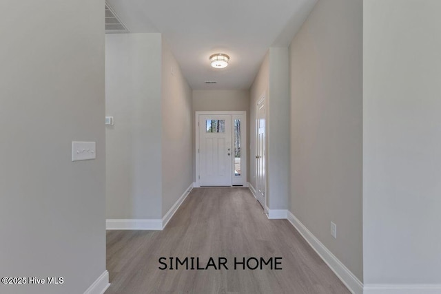 98 NE Dr NW, Calabash, NC 28467 - foyer featuring wood finished floors and baseboards