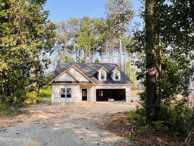 311 Front St, Vass, NC 28394 - unfinished property with a garage and driveway
