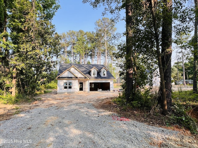 311 Front St, Vass, NC 28394 - unfinished property with dirt driveway and a garage
