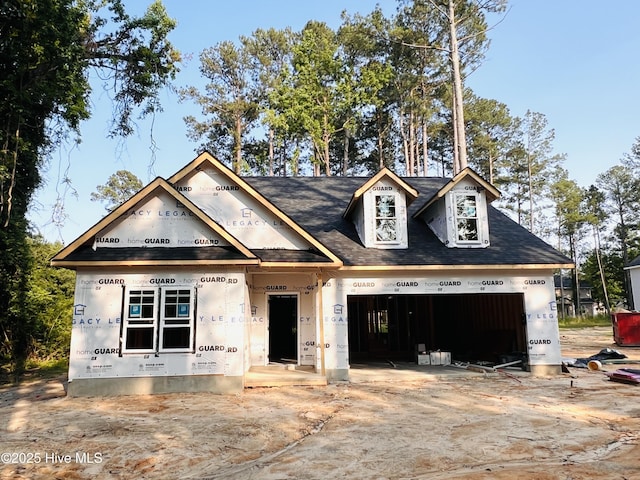 311 Front St, Vass, NC 28394 - unfinished property featuring an attached garage, driveway, and a shingled roof