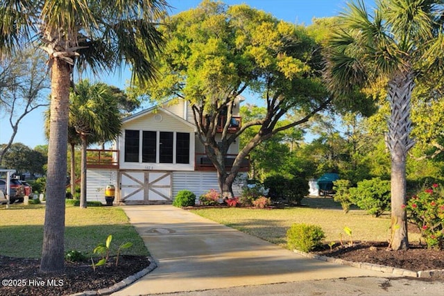 102 E Island Dr, Oak Island, NC 28465 - view of front of home with a front yard and driveway
