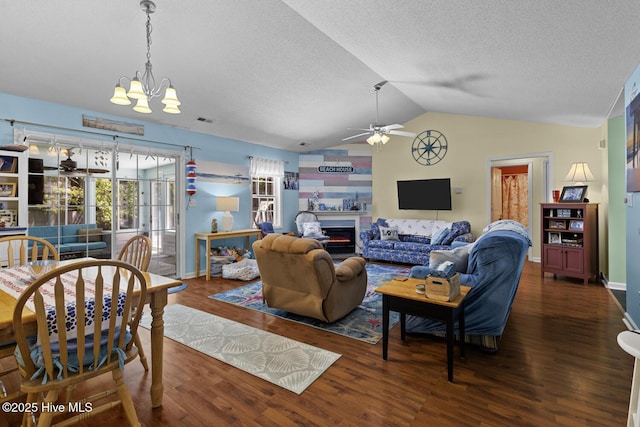 107 Foxlair Dr, Hubert, NC 28539 - living room featuring a ceiling fan, a chandelier, wood finished floors, lofted ceiling, and a textured ceiling