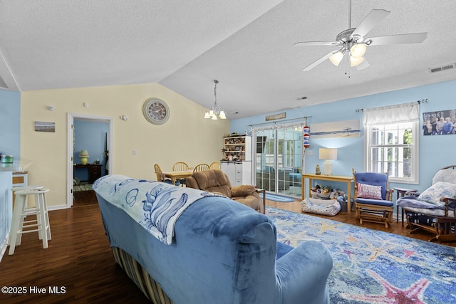 107 Foxlair Dr, Hubert, NC 28539 - living room with lofted ceiling, healthy amount of natural light, a chandelier, a textured ceiling, and wood finished floors