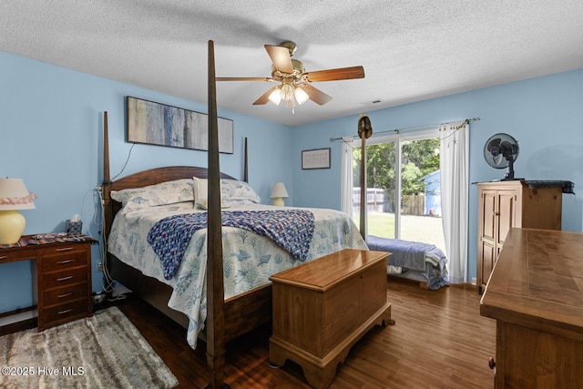 107 Foxlair Dr, Hubert, NC 28539 - bedroom with wood finished floors, a textured ceiling, a ceiling fan, and access to exterior