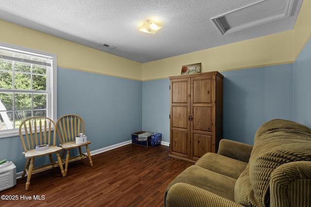 107 Foxlair Dr, Hubert, NC 28539 - living area with attic access, dark wood finished floors, a textured ceiling, and baseboards