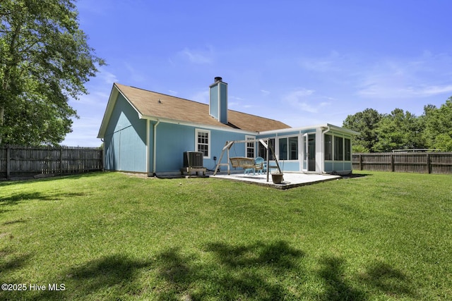 107 Foxlair Dr, Hubert, NC 28539 - rear view of house featuring a patio, a sunroom, a chimney, and cooling unit