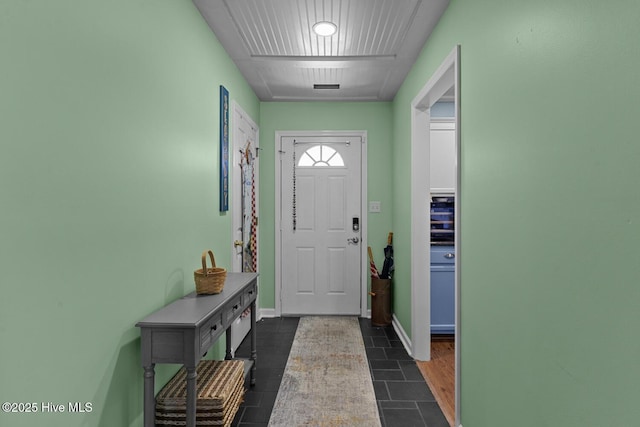 107 Foxlair Dr, Hubert, NC 28539 - foyer with baseboards and dark tile patterned flooring