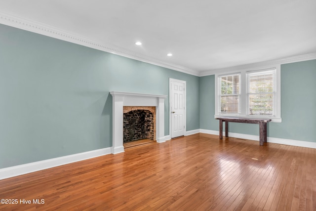 114 N 16th St, Wilmington, NC 28401 - unfurnished living room featuring crown molding, hardwood / wood-style flooring, a fireplace, and recessed lighting