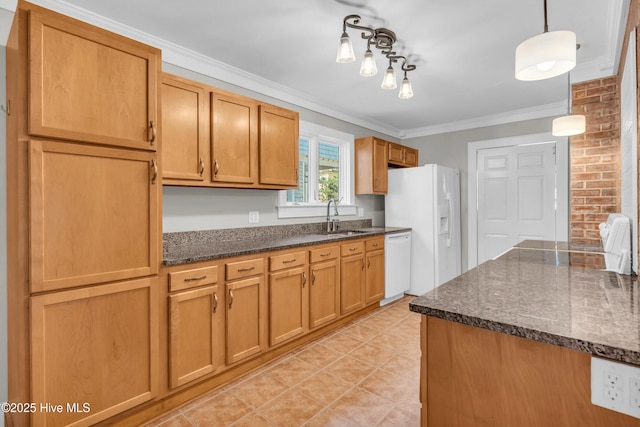 114 N 16th St, Wilmington, NC 28401 - kitchen with white appliances, crown molding, dark stone counters, light tile patterned flooring, and decorative light fixtures