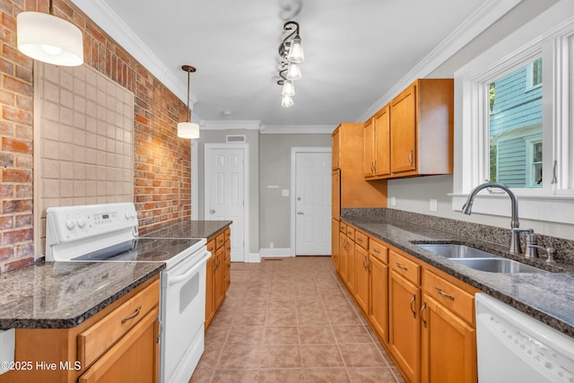 114 N 16th St, Wilmington, NC 28401 - kitchen with white appliances, crown molding, light tile patterned floors, pendant lighting, and brown cabinetry